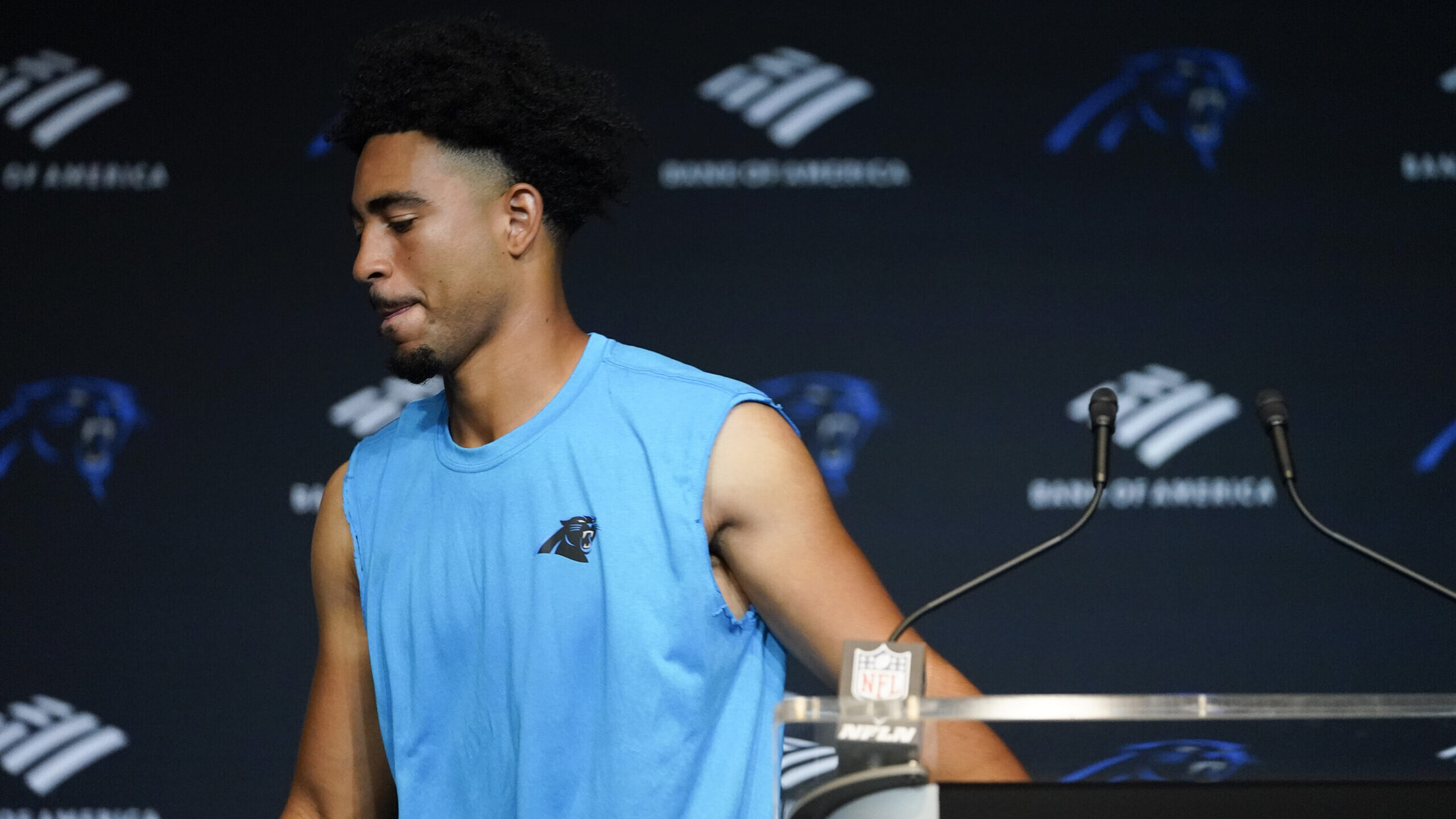 Carolina Panthers quarterback Bryce Young leaves a news conference...