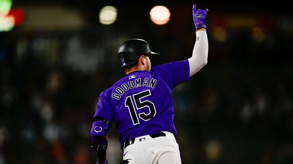Hunter Goodman #15 of the Colorado Rockies celebrates his seventh inning solo home run at Coors Fie...