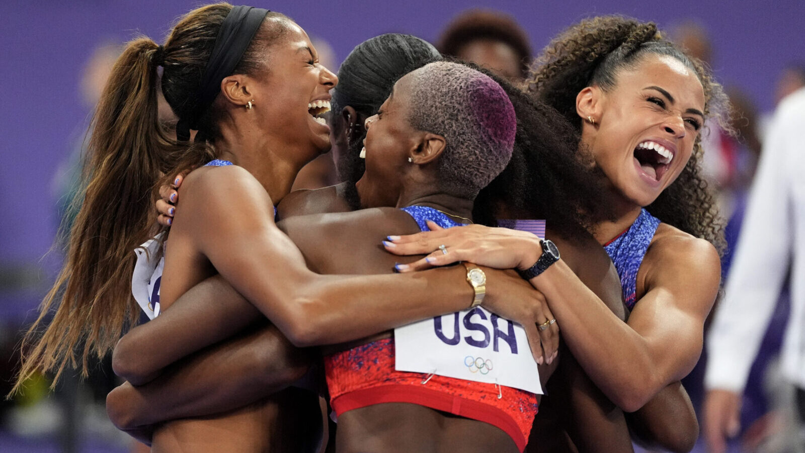 Women's 4x400 meter runners for Team USA celebrate gold at Paris Olympics...