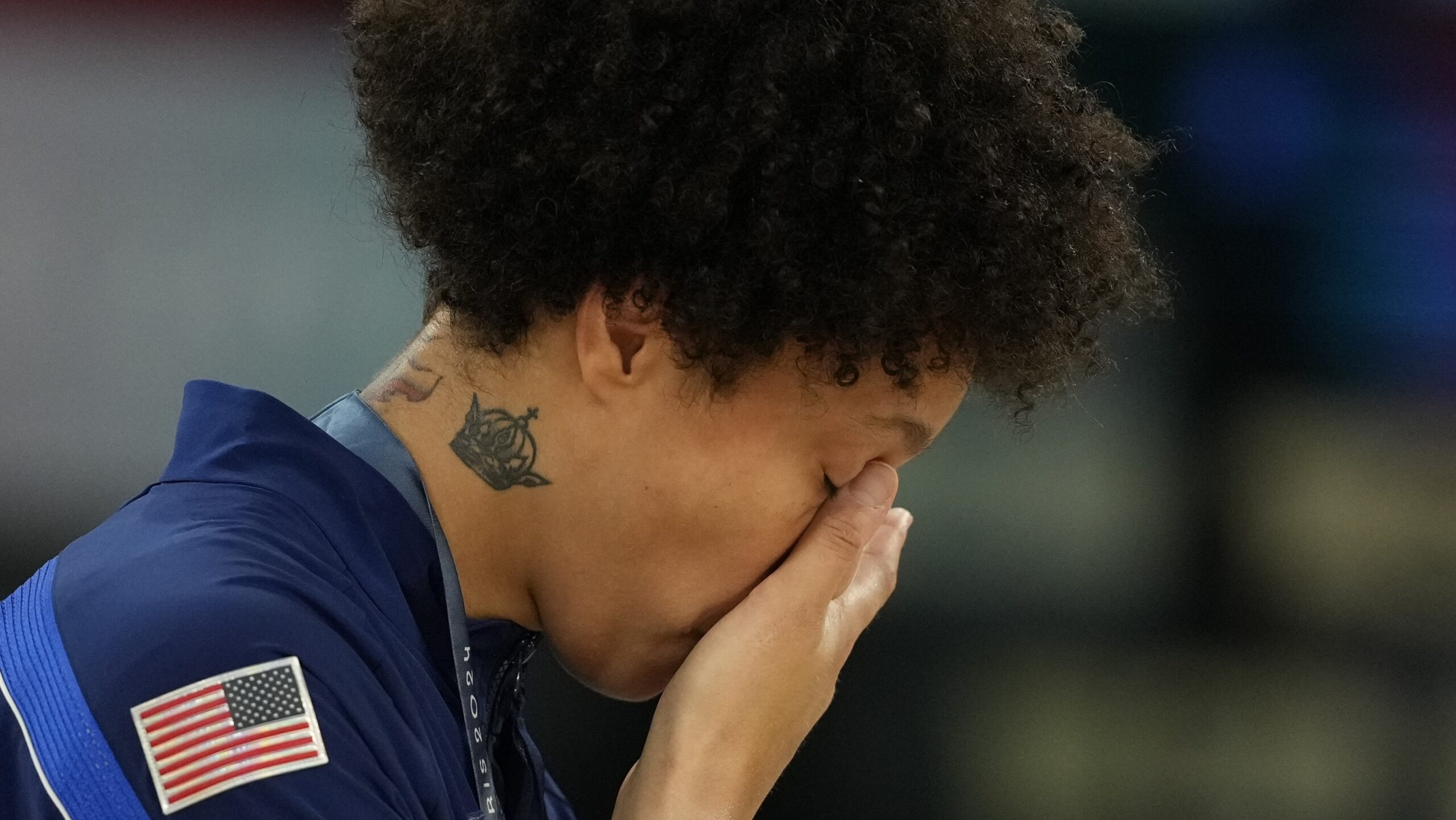 United States' Brittney Griner wipes a tear after a women's gold medal basketball game at Bercy Are...