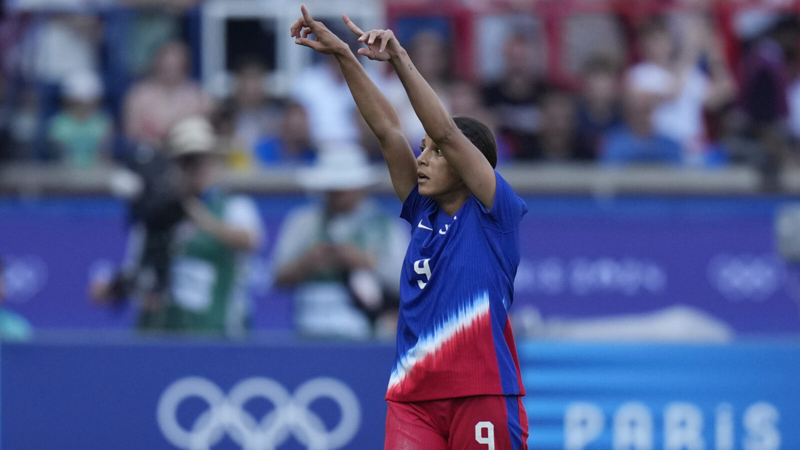 USWNT Mallory Swanson points to sky after scoring lone goal of gold medal game vs. Brazil...