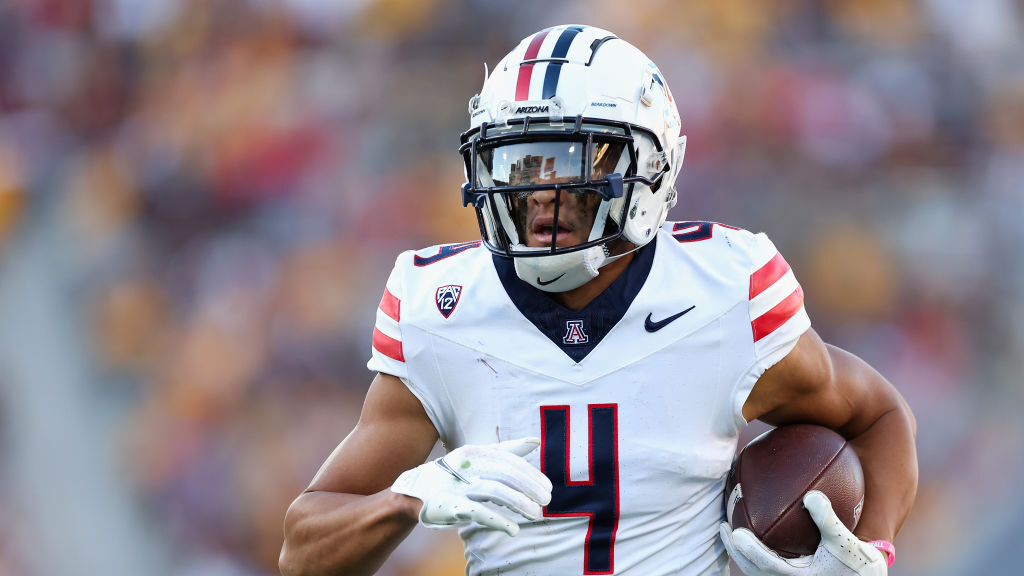 Wide receiver Tetairoa McMillan runs after the catch...
